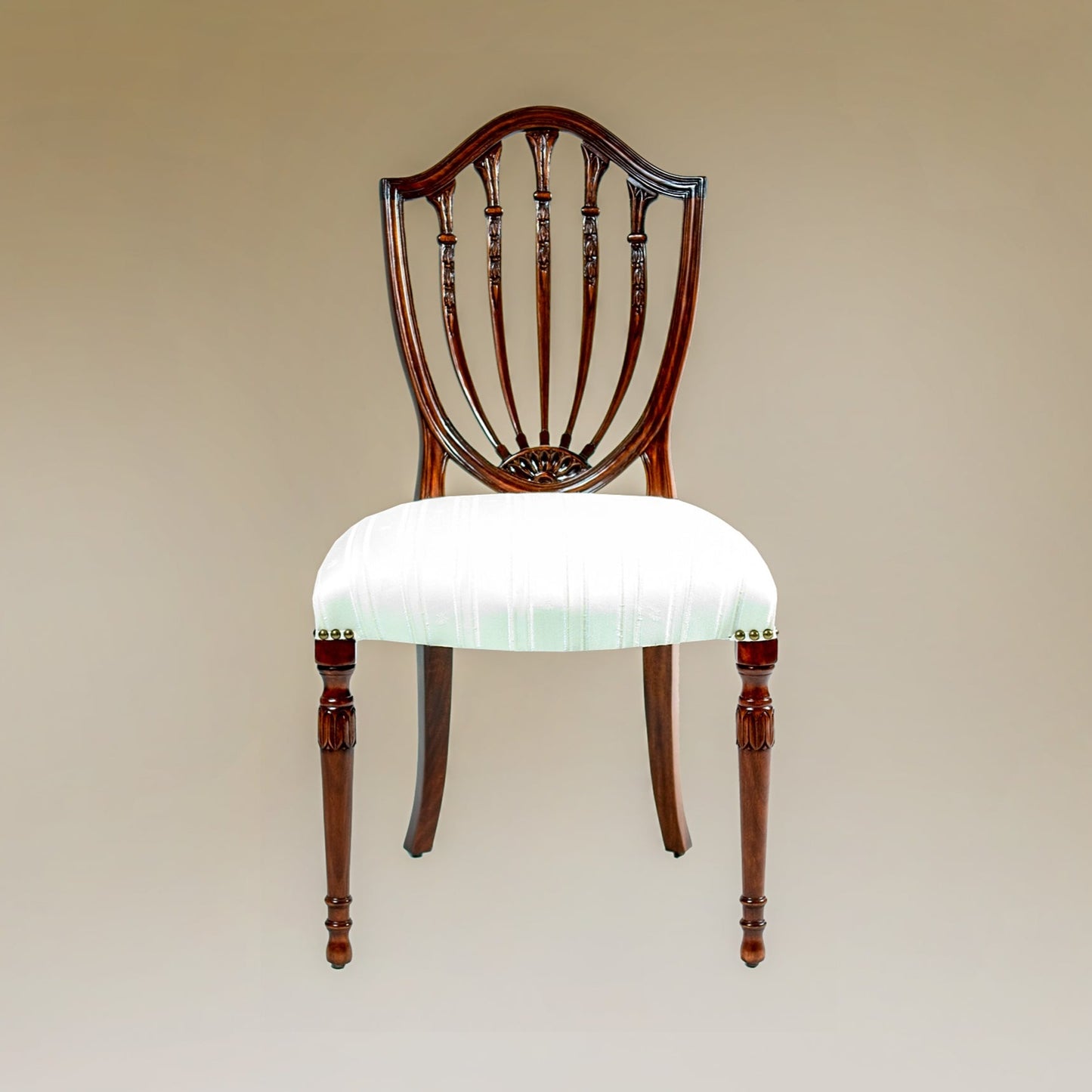 Prince of Wales side chair featuring a carved back and cushioned seat.