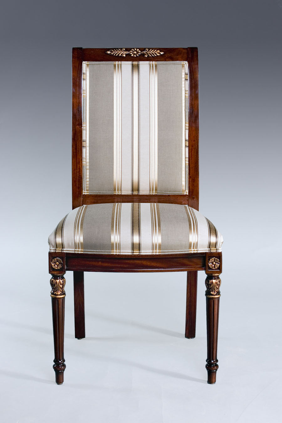 Side profile of Brenda Empire-style chair highlighting intricate woodwork.