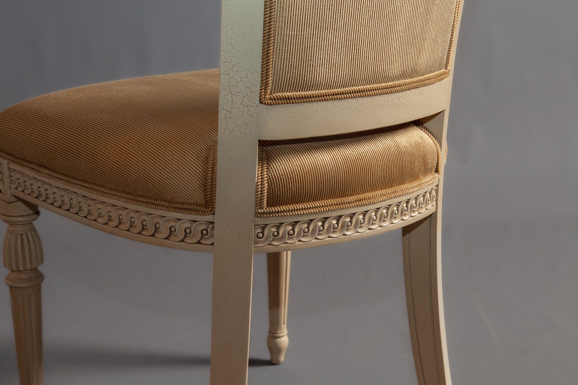 Close-up of the chair's leg detailing and foot design.