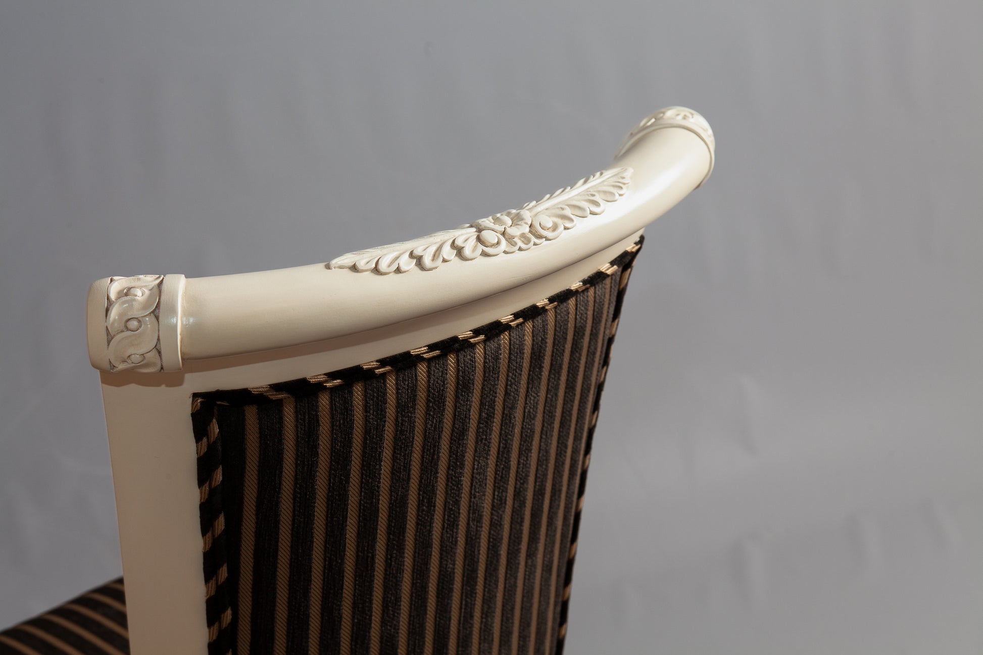Angled perspective capturing the chair's elegant form and structure.
