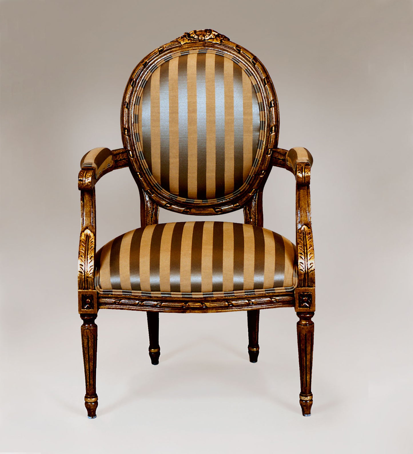 Louis XVI-style chair with fluted legs and upholstered backrest.