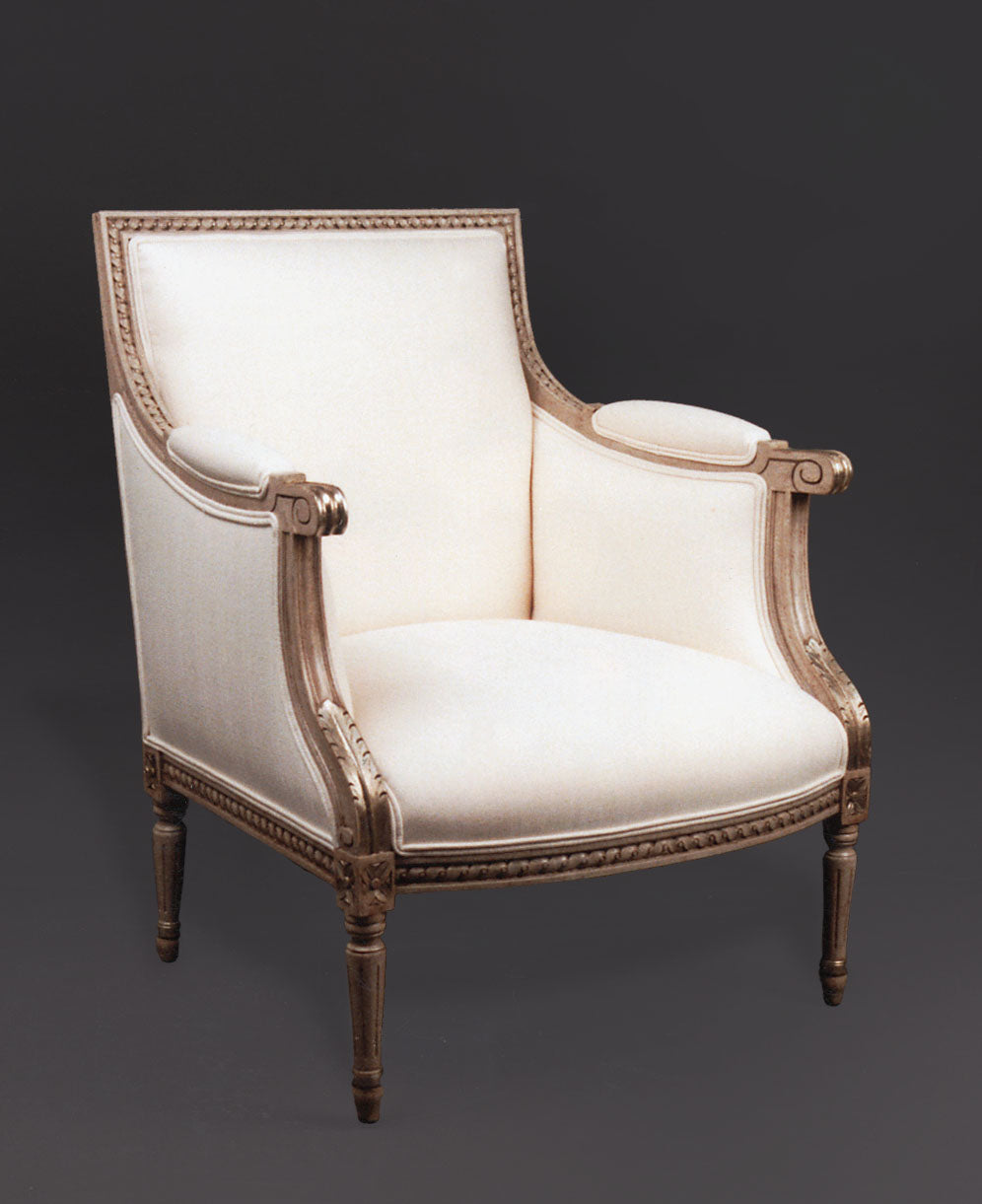 Antique French style armchair with carved wood frame
