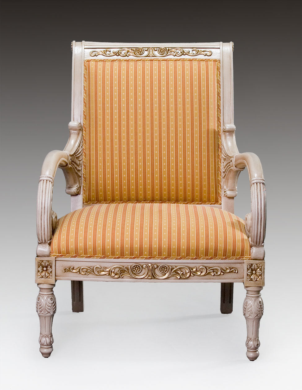 Versace armchair featuring intricate carvings and plush fabric.