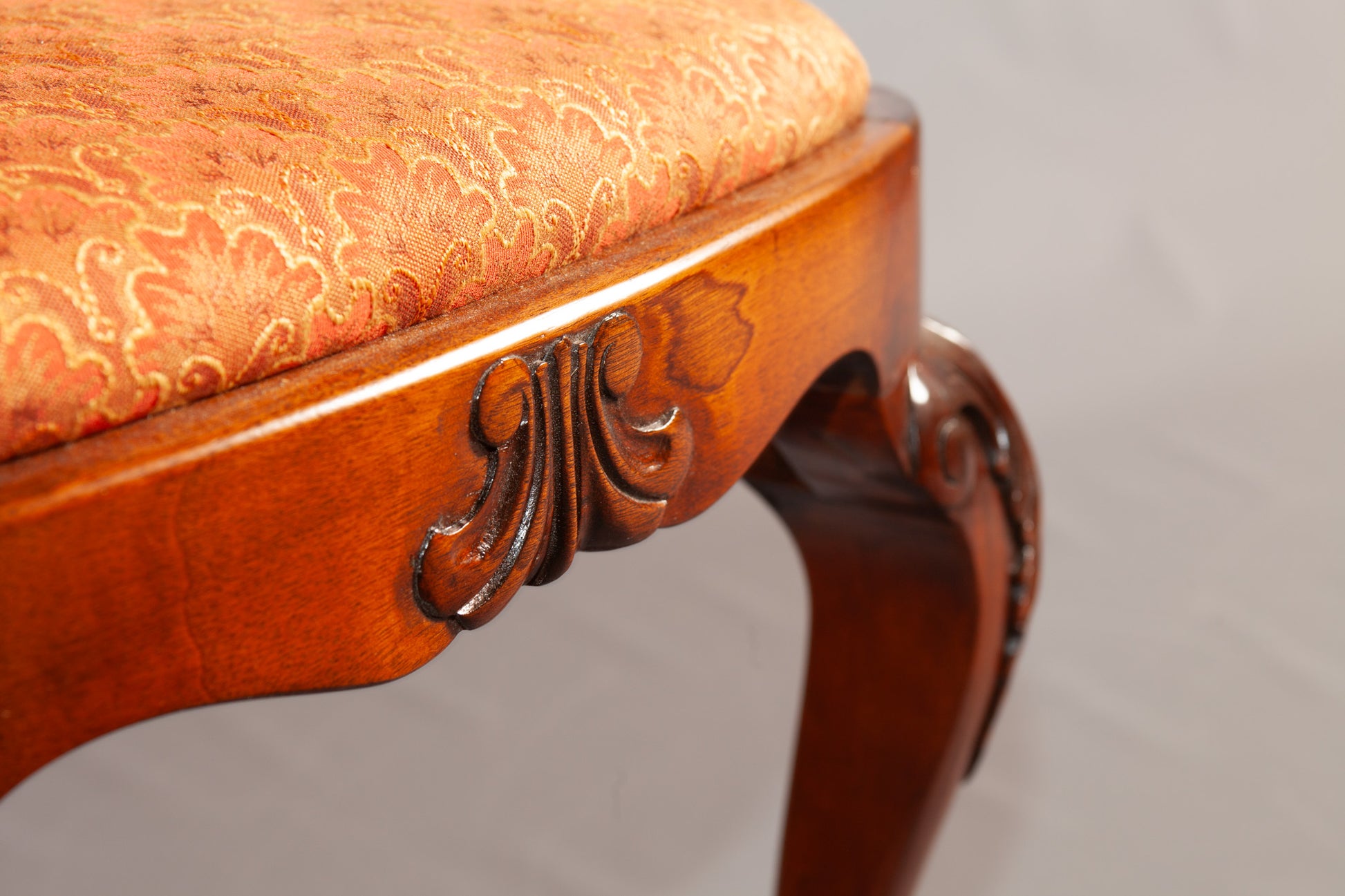 Side chair featuring ornate design and plush cushioning.