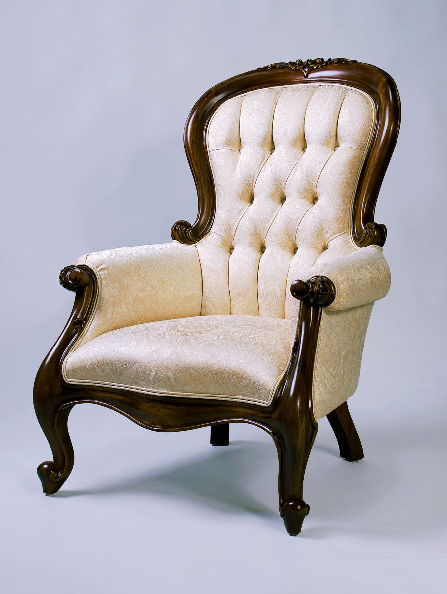 Side view of a grandfather armchair showcasing its high back and refined details.