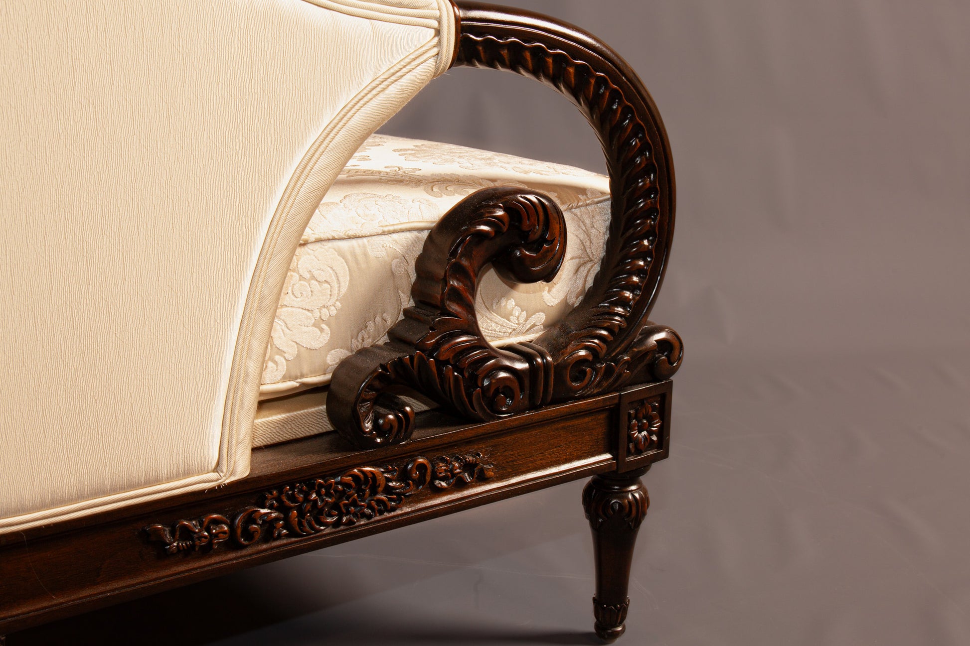 Classic wooden armchair featuring a detailed frame and luxurious upholstery.