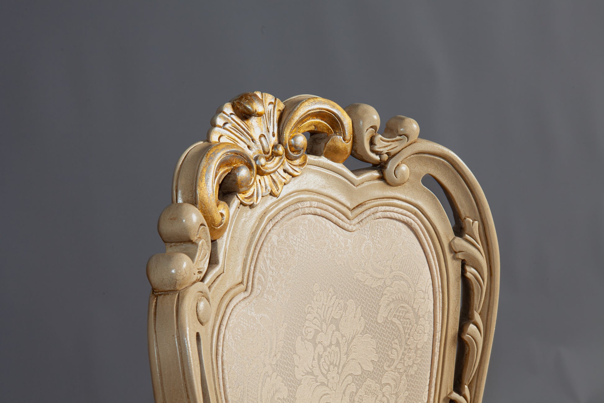 Elegant Francisca chair featuring ornate carvings and upholstered seat.