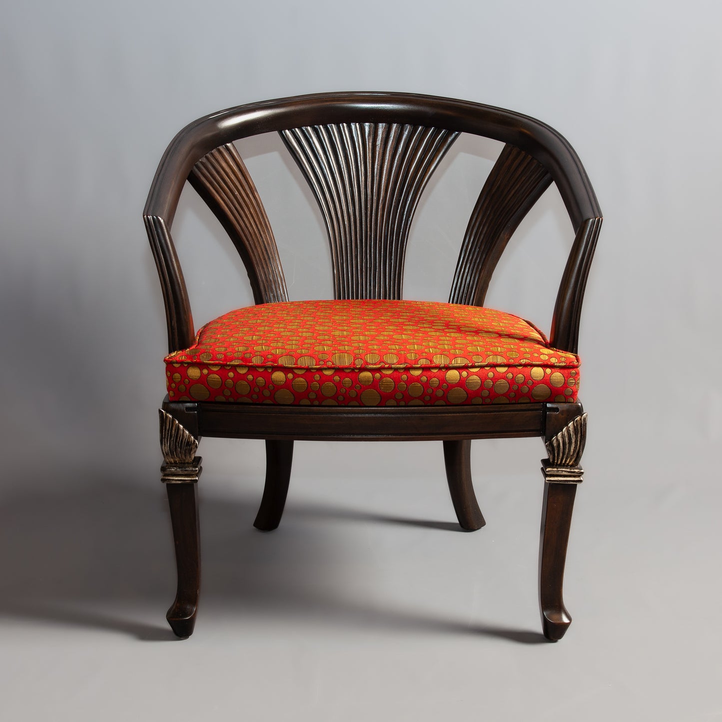 Classic chair furniture with intricate carvings.