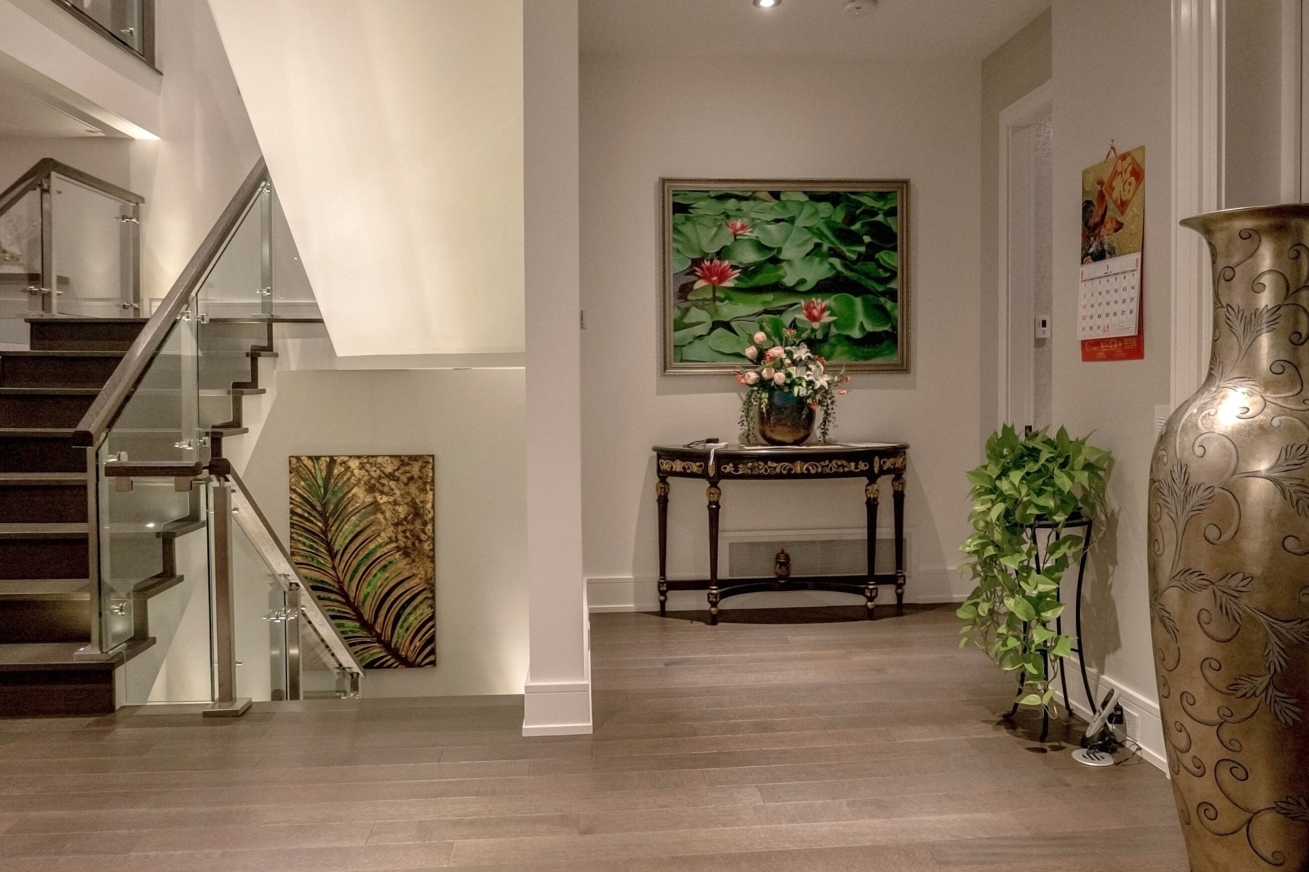 Modern entryway with a glass staircase - House of Chippendale