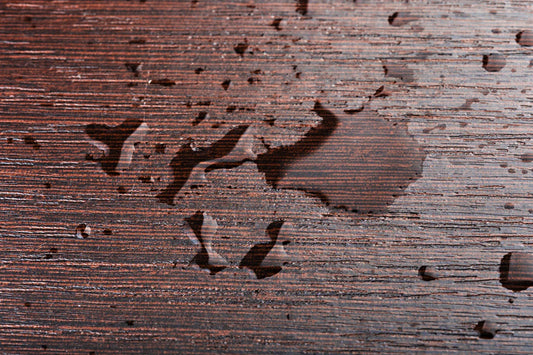 Water drops on wooden table - House of Chippendale