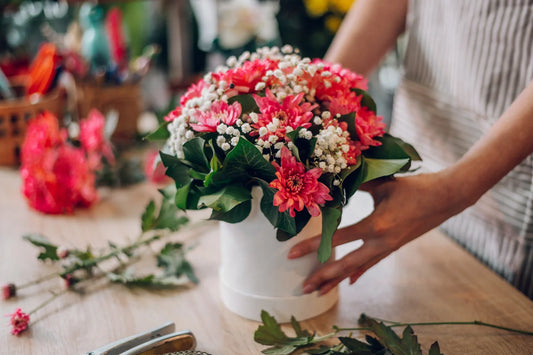 florist woman creating flower arrangement