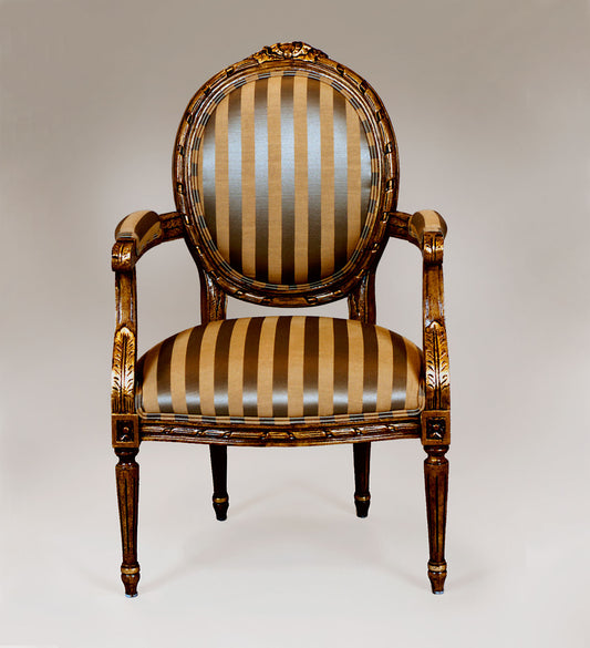 Louis XVI-style chair with fluted legs and upholstered backrest.