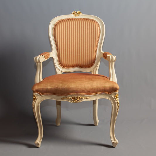 Full front view of a Louis XV armchair with classic design and comfortable seating