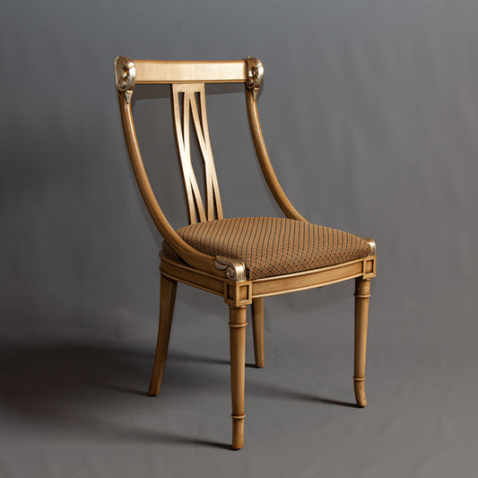 Front view of armchair emphasizing its elegant design and comfortable seating.
