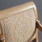 Close-up of the chair’s armrest featuring intricate carvings.