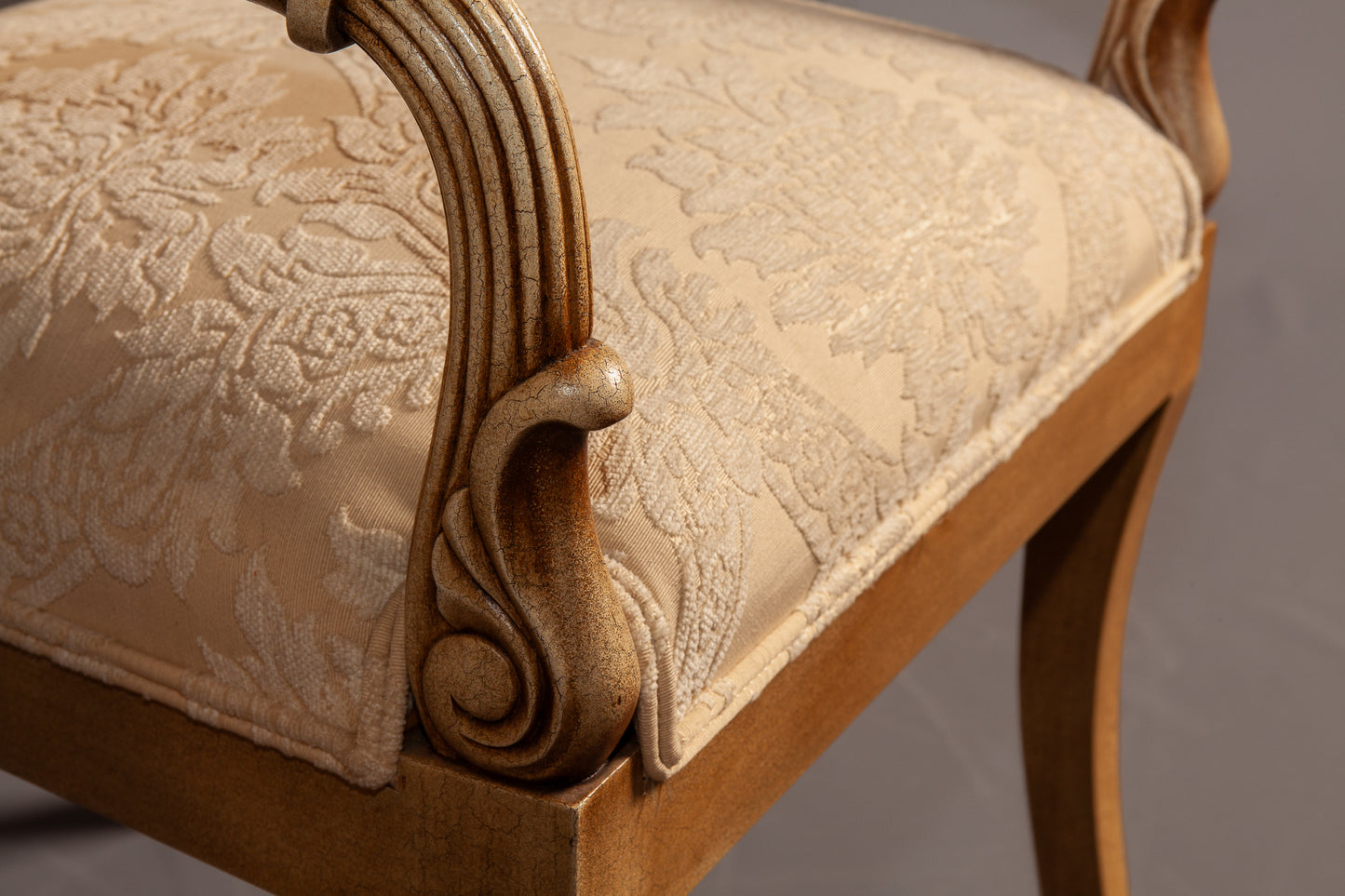 Detailed view of the chair’s backrest showcasing its elegant woodwork.