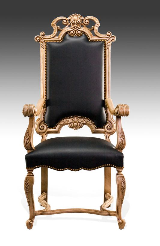 Jacobean-style armchair with detailed wood carvings and rich upholstery.