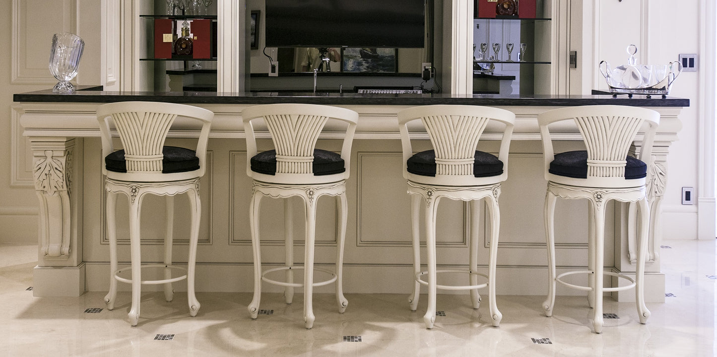 Wooden fanback chair with curved backrest and slatted design.