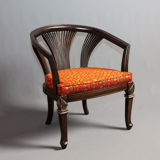 Side view of classic chair furniture with intricate carvings.