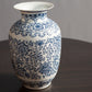 Detail view of blue and white porcelain vase with floral pattern