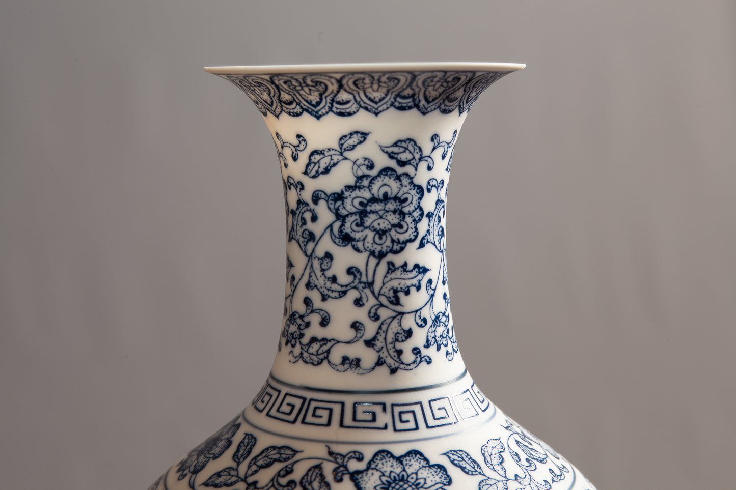 Close up view of a blue and white porcelain vase 