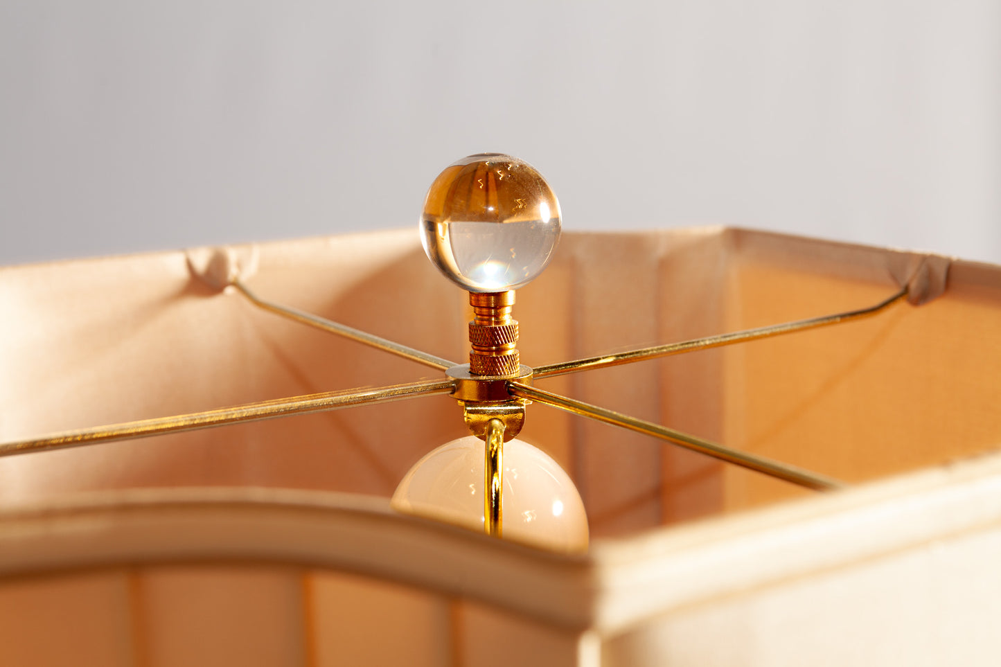 Side view of the Crystal Swirl Lamp, highlighting its elegant brass and crystal structure