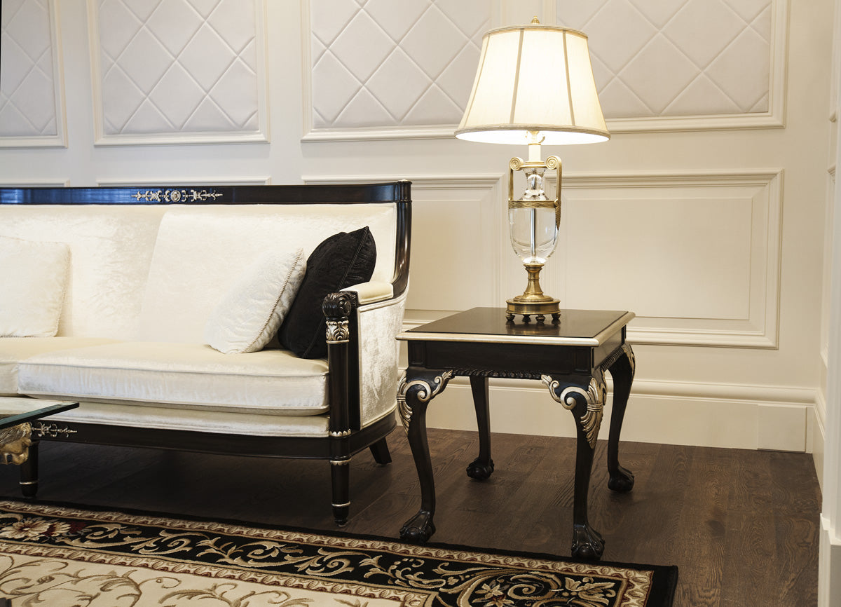 Living room featuring two distinct seating areas, designed for comfort and style
