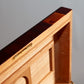 Front view of the Mahogany Walnut Humidor, showcasing its polished wood and gold accents