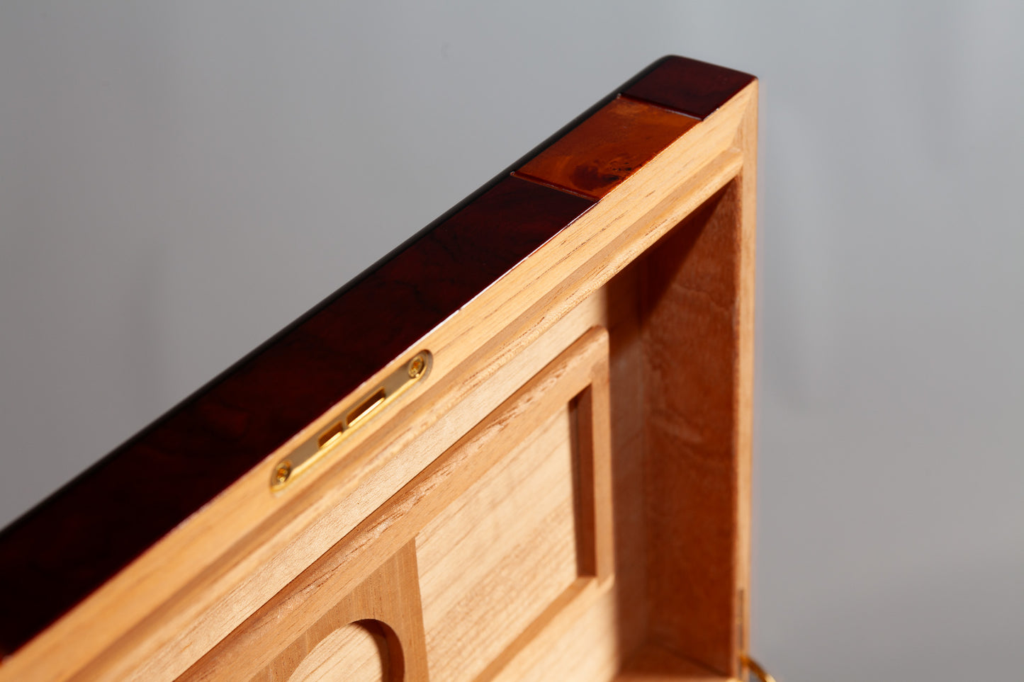 Front view of the Mahogany Walnut Humidor, showcasing its polished wood and gold accents